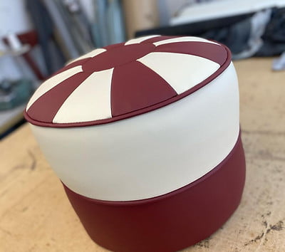 Round foot stool in burgundy and cream leather Footstool Reupholstery